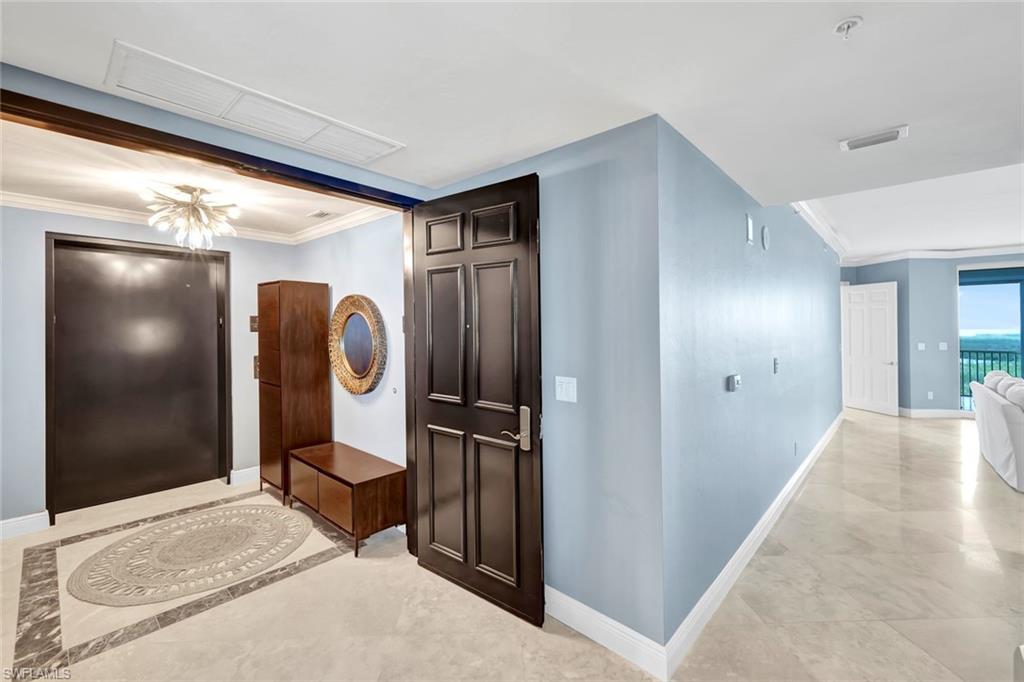 275 Indies Way, Unit 902 Naples, FL 34110 - Photo 2 of 39 a view of a hallway with elevator