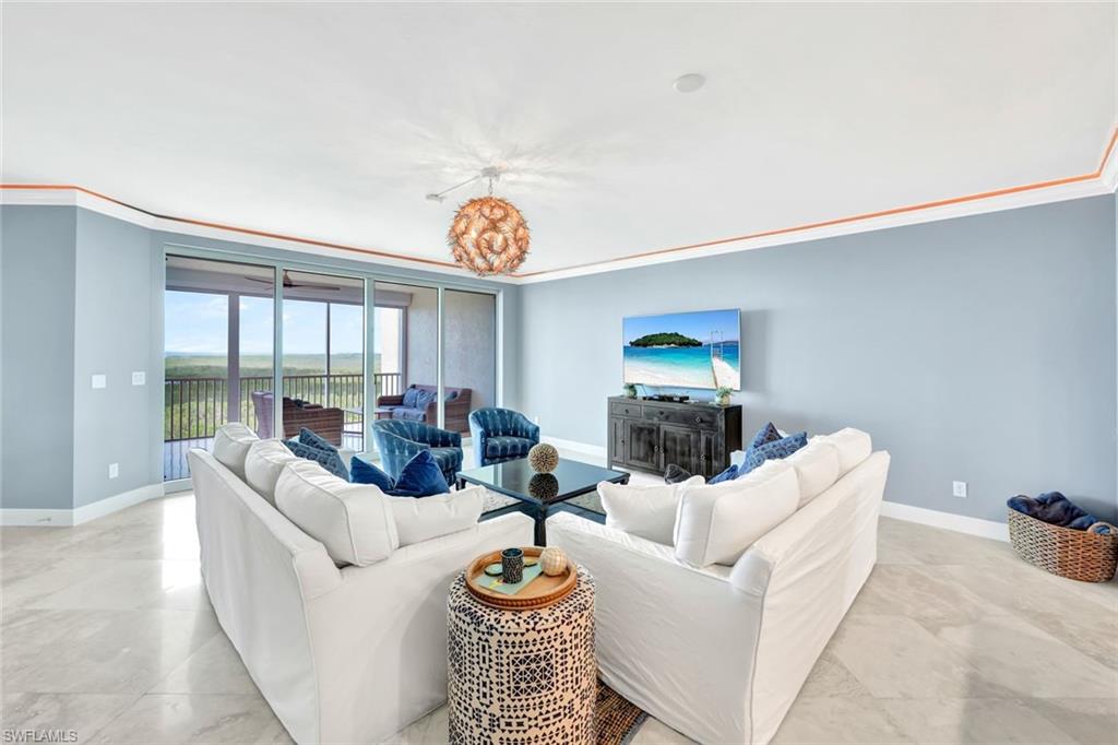 275 Indies Way, Unit 902 Naples, FL 34110 - Photo 3 of 39 a living room with furniture and a window