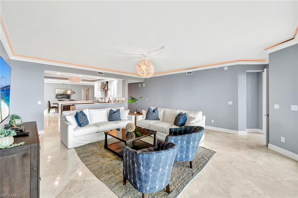 275 Indies Way, Unit 902 Naples, FL 34110 - Photo 5 of 39 a living room with furniture and view of kitchen