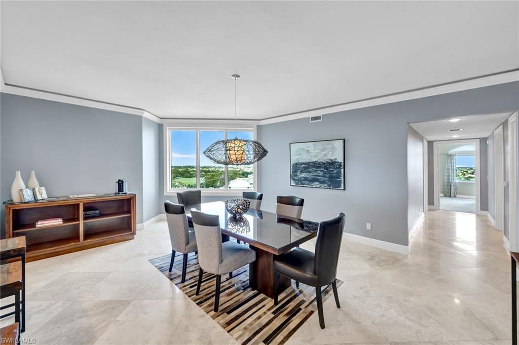 275 Indies Way, Unit 902 Naples, FL 34110 - Photo 10 of 39 a dining room with furniture and window
