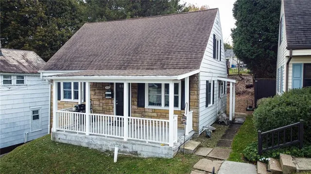 a house view with a garden space