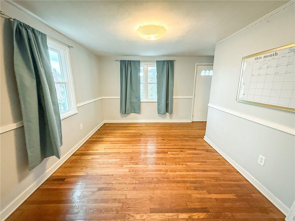 201 Wallula Avenue Butler, PA 16001 - Photo 15 of 41 a view of an empty room with wooden floor and a window