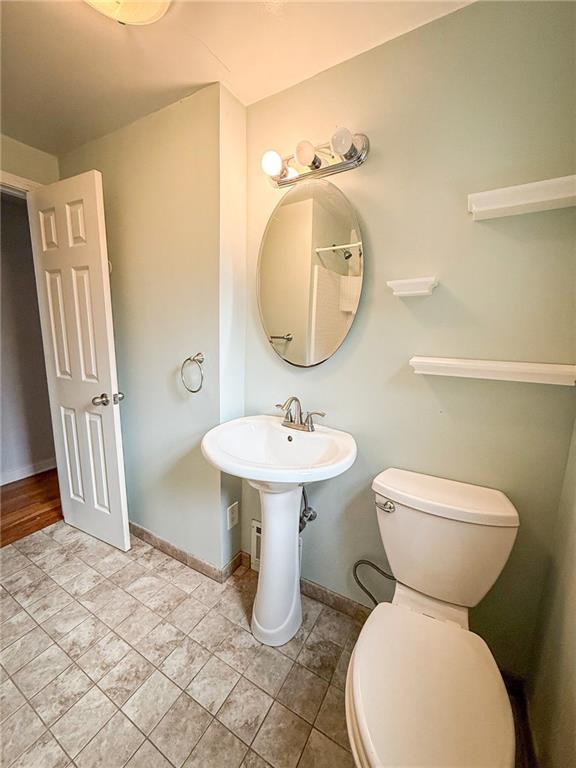 201 Wallula Avenue Butler, PA 16001 - Photo 17 of 41 a bathroom with a toilet sink and mirror