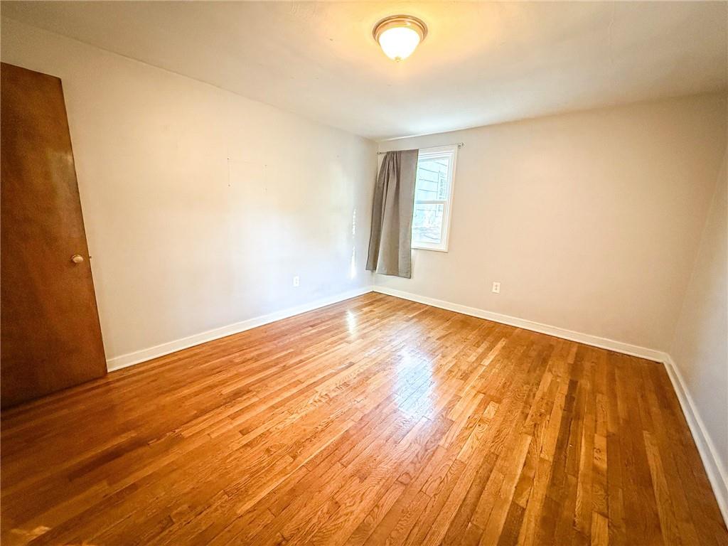 201 Wallula Avenue Butler, PA 16001 - Photo 19 of 41 an empty room with wooden floor and windows