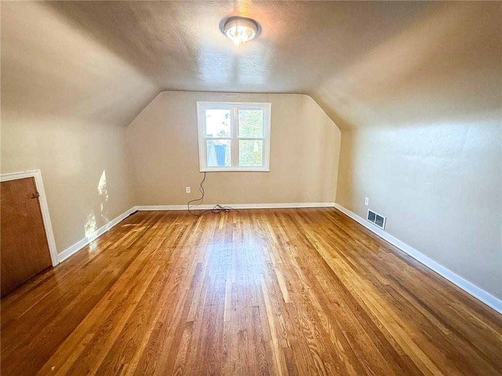201 Wallula Avenue Butler, PA 16001 - Photo 28 of 41 an empty room with wooden floor and windows