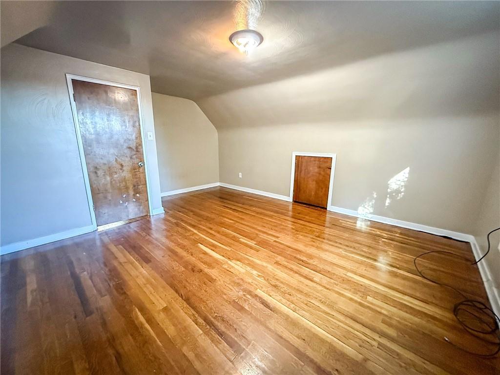 201 Wallula Avenue Butler, PA 16001 - Photo 31 of 41 a view of an empty room with wooden floor and a window