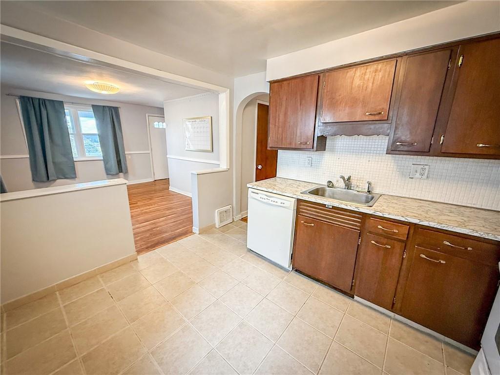 201 Wallula Avenue Butler, PA 16001 - Photo 7 of 41 a kitchen with stainless steel appliances a sink cabinets and a window