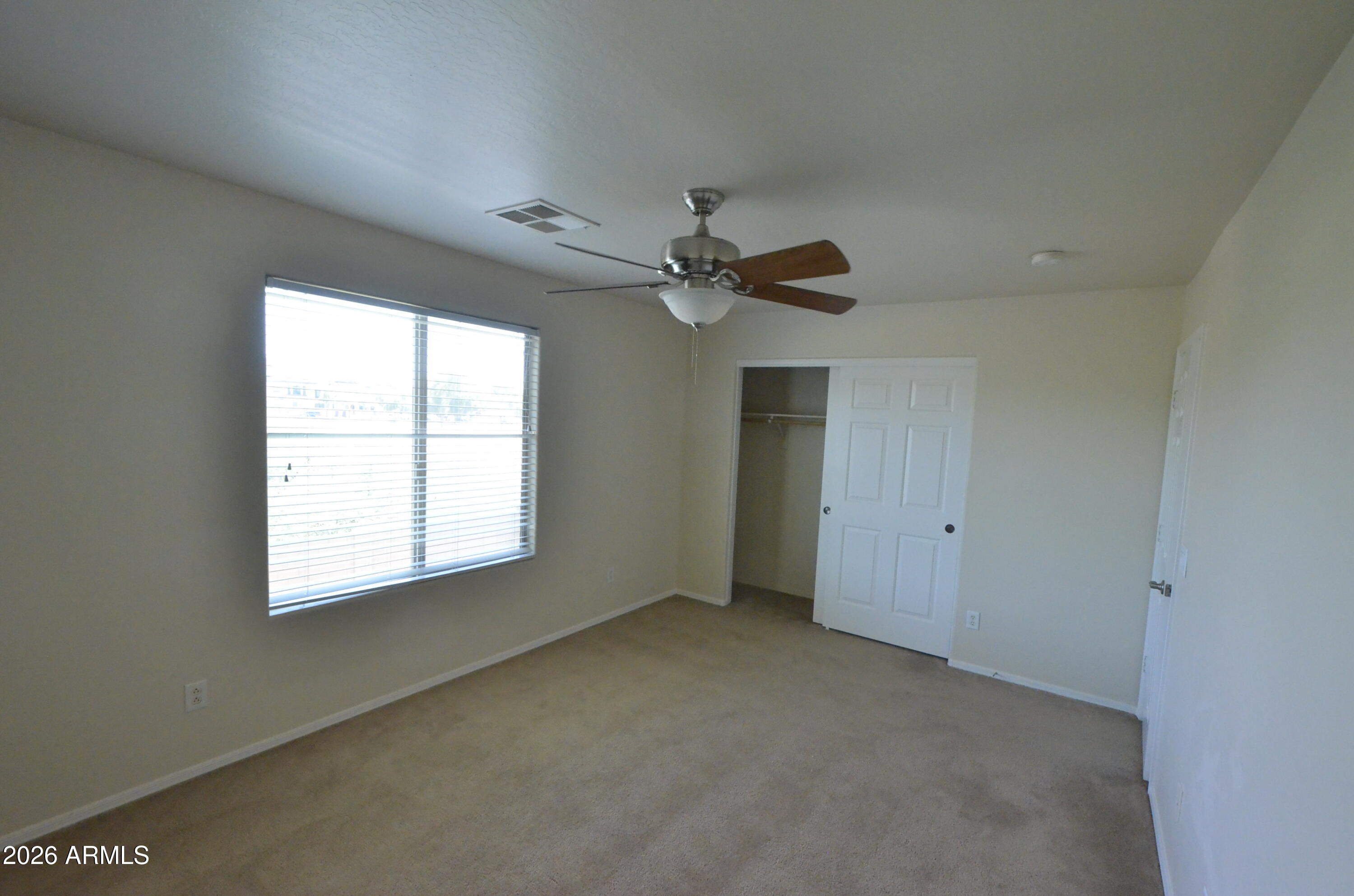 3995 East Trigger Way Gilbert, AZ 85297 - Photo 18 of 23 a view of an empty room with a window