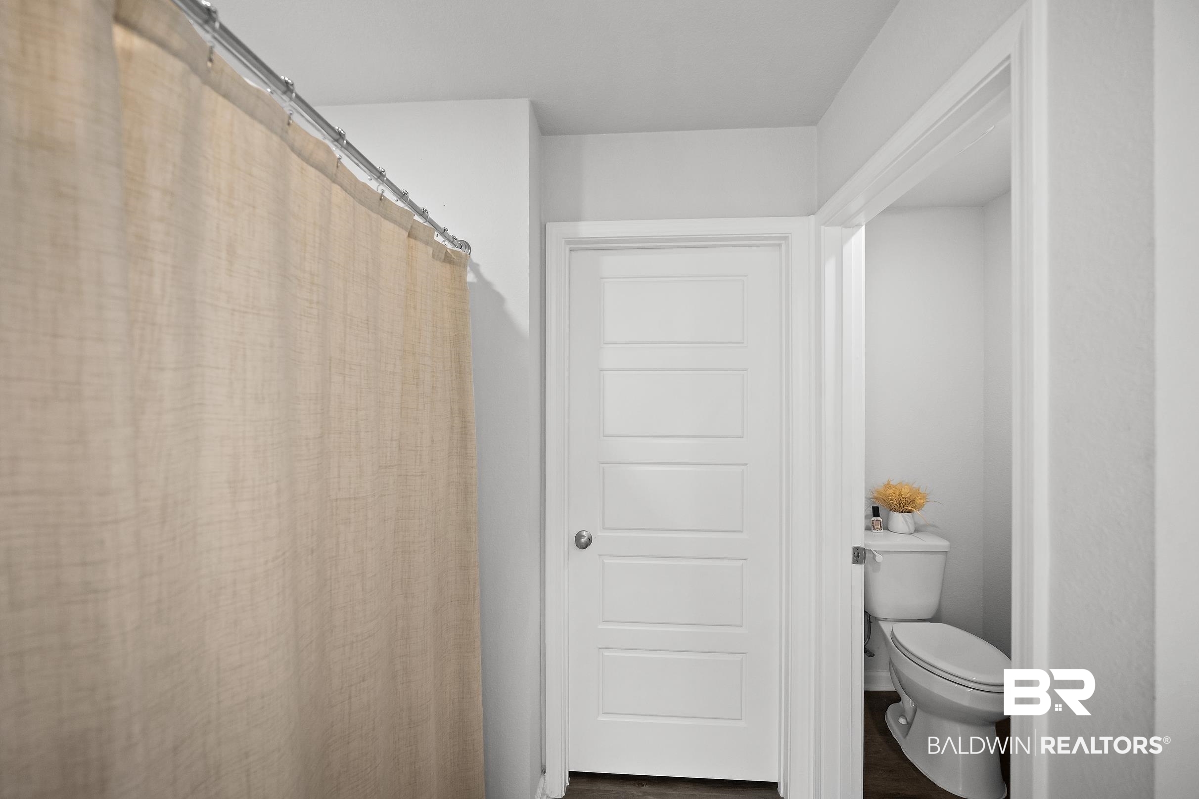 32030 Terranova Loop Lillian, AL 36549 - Photo 14 of 30 White paneled door with a brushed nickel knob and a bright interior