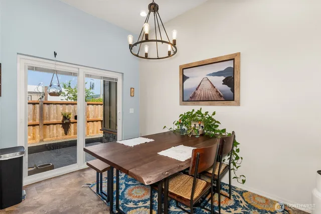 a view of a hallway with white wooden cabinets