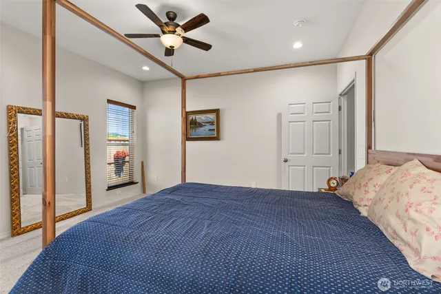 a bathroom with a sink double vanity mirror and a bathtub