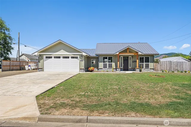 a front view of a house with a yard