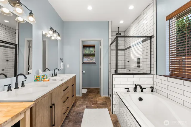 a bathroom with a sink double vanity and a mirror