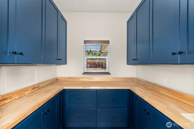 a backyard of a house with yard fire pit and outdoor seating