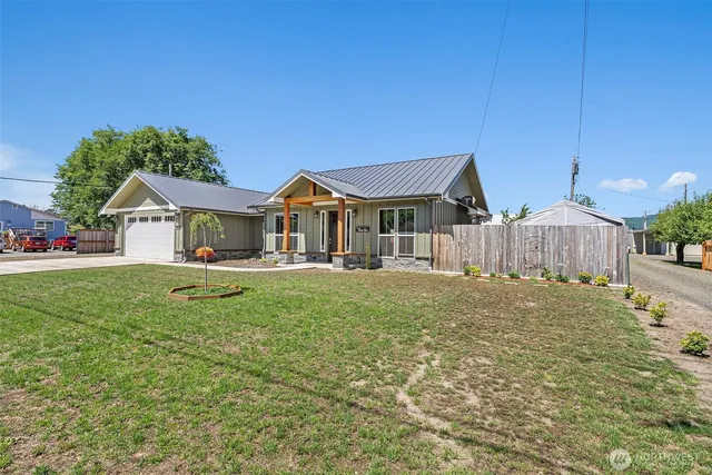 a front view of a house with a yard