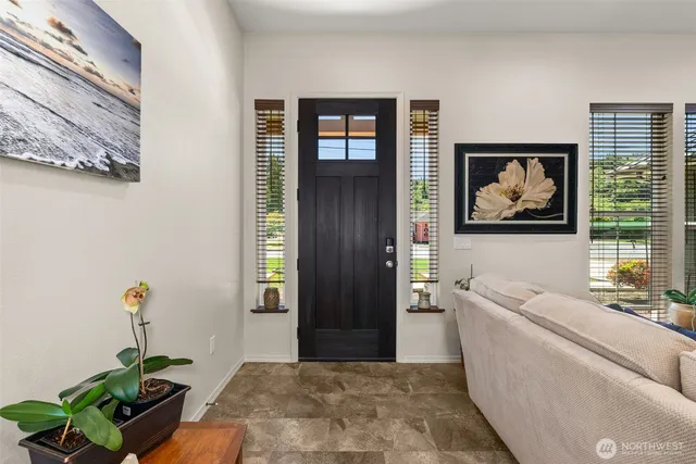 a living room with furniture and window