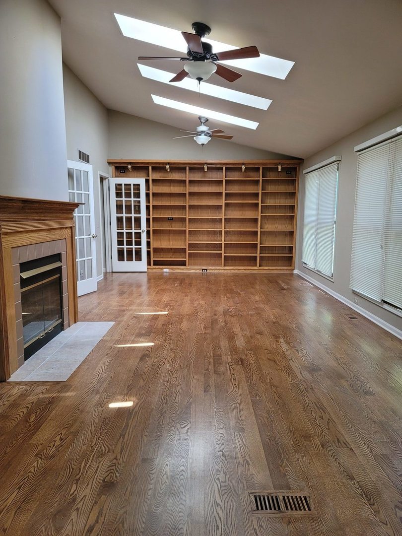 950 Ripple Brook Lane Elgin, IL 60120 - Photo 15 of 38 a view of an empty room with a fireplace and a window