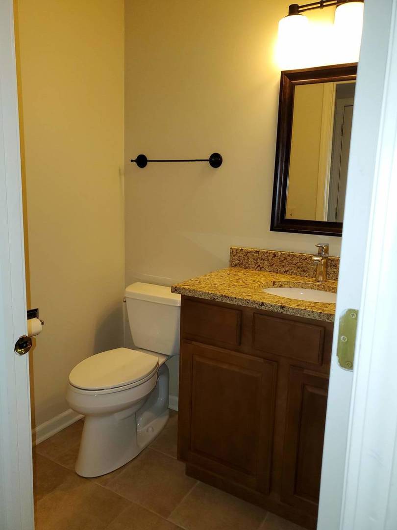 950 Ripple Brook Lane Elgin, IL 60120 - Photo 18 of 38 a bathroom with a sink and a toilet
