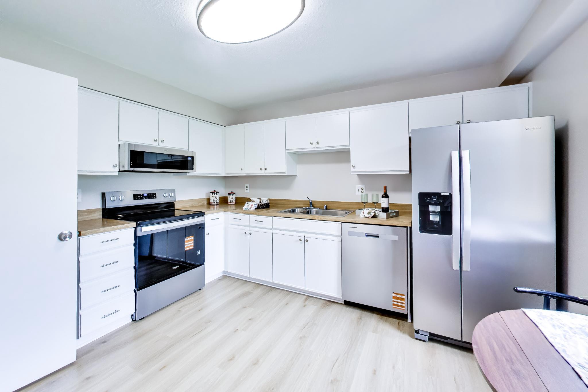 15100 Interlachen Drive, Unit 4612 Silver Spring, MD 20906 - Photo 7 of 19 Modern Kitchen with Sleek Finishes. View 1.