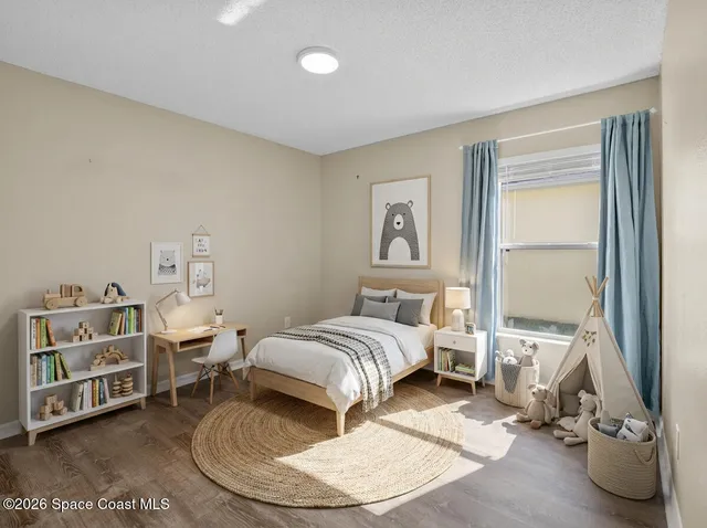 a room with a bed and a window