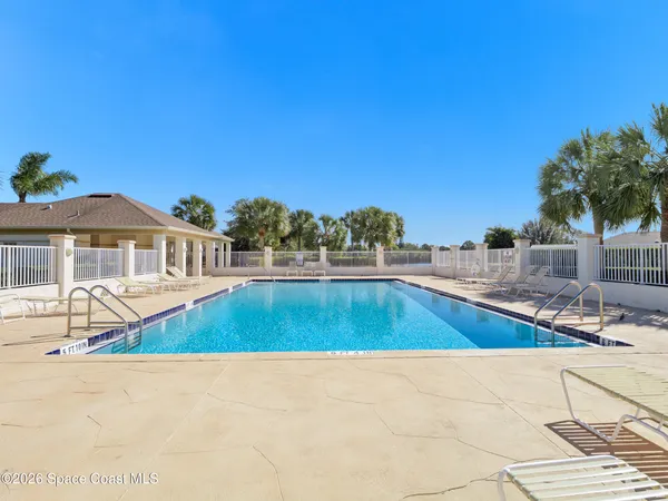 a view of a house with swimming pool