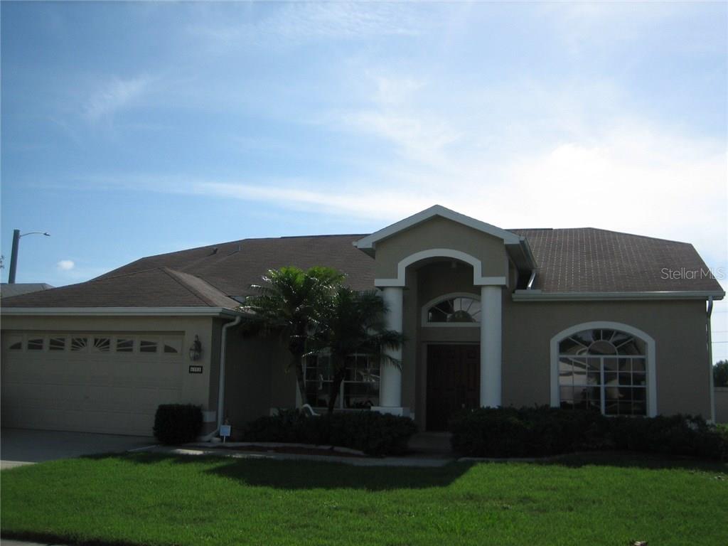 4351 Onorio Street New Port Richey, FL 34653 - Photo 1 of 1 a front view of a house with a garden