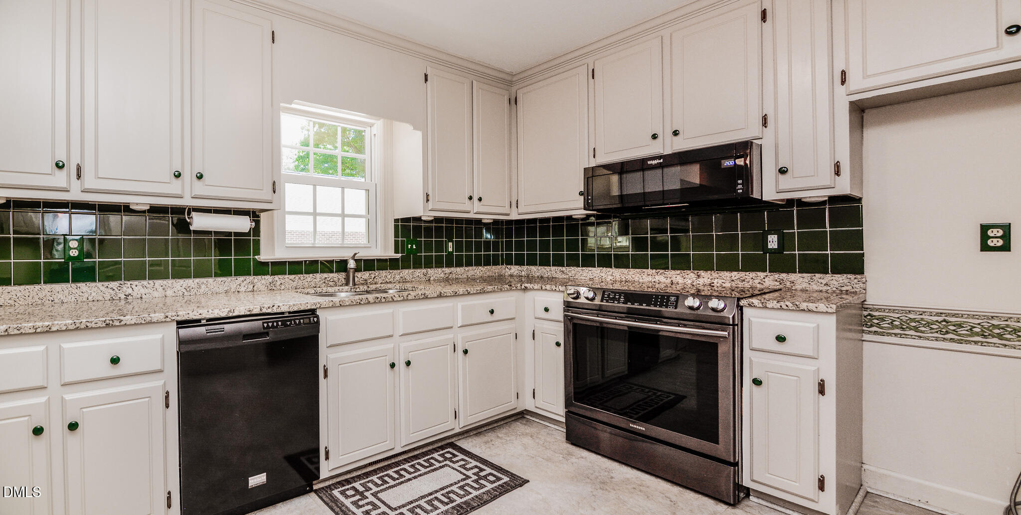 1215 Cambridge Road Northwest Wilson, NC 27896 - Photo 26 of 54 a kitchen with granite countertop white cabinets and white appliances