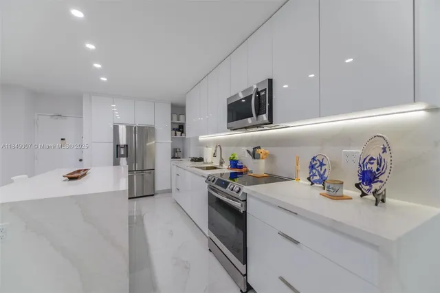 a kitchen with a refrigerator and a sink