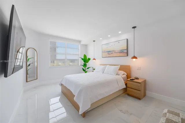 a bedroom with a bed and a dresser