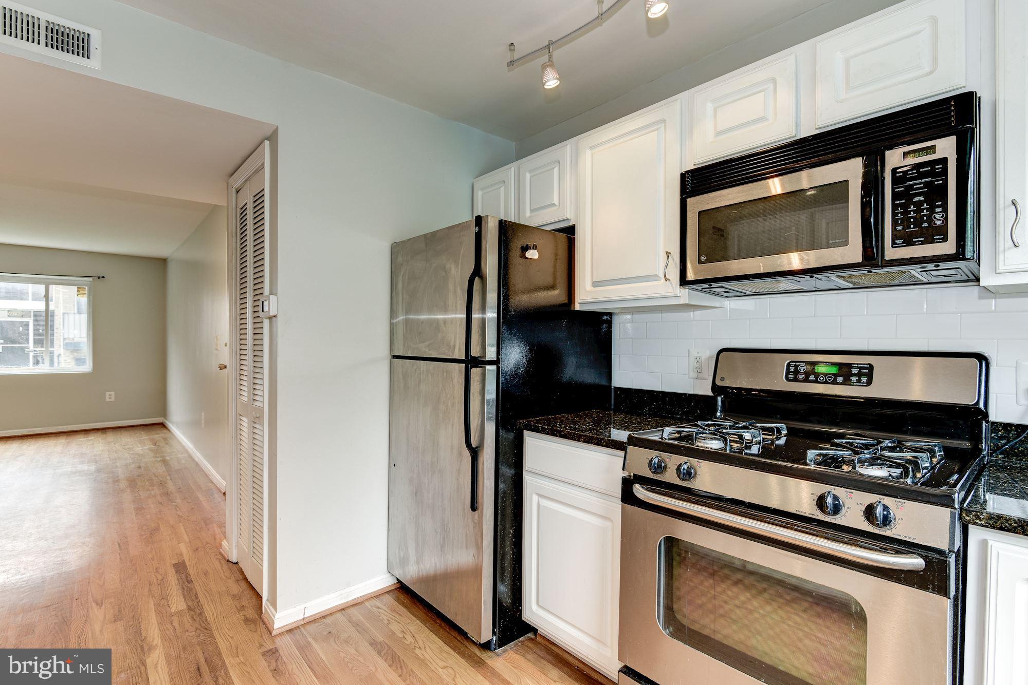 4210 Benning Road Northeast, Unit 4 Washington, DC 20019 - Photo 6 of 11 Kitchen heading to living area