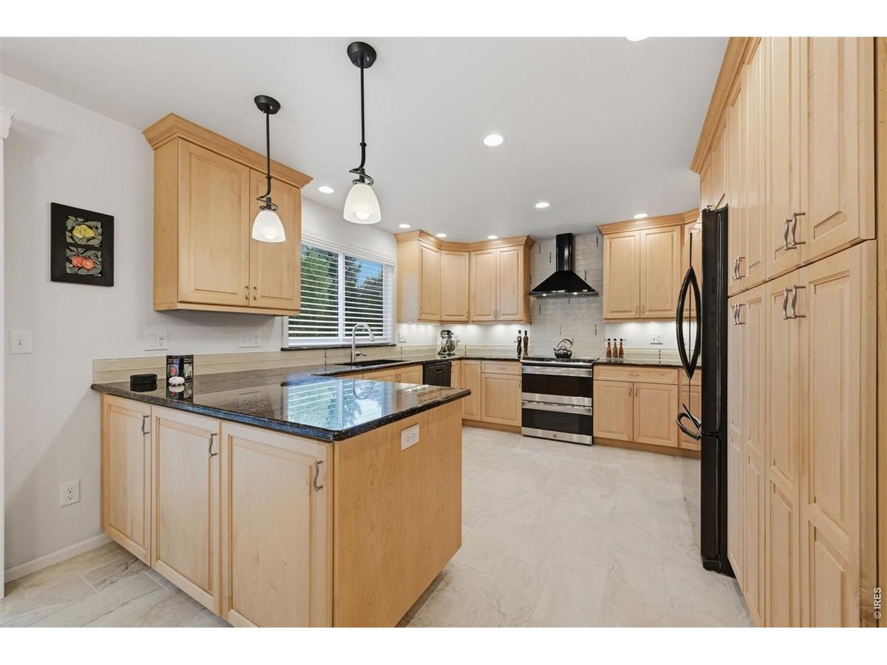 3754 Kentford Road Fort Collins, CO 80525 - Photo 10 of 50 Granite countertops and custom tile backsplash