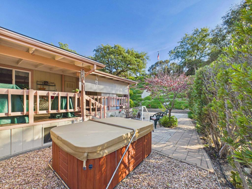 18218 Paradise Mountain Road, Unit 220 Valley Center, CA 92082 - Photo 41 of 48 a view of a house with backyard and sitting area