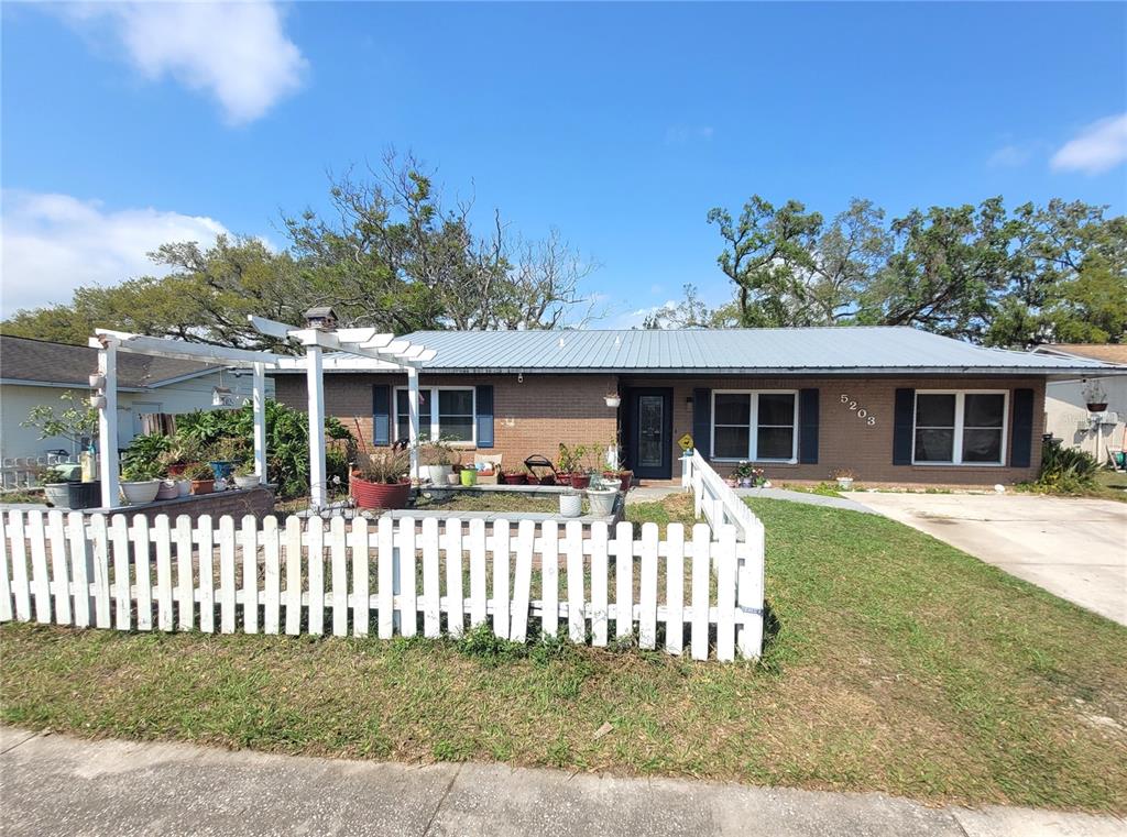 5203 Presidential Street Seffner, FL 33584 - Photo 1 of 21 a front view of a house with a garden