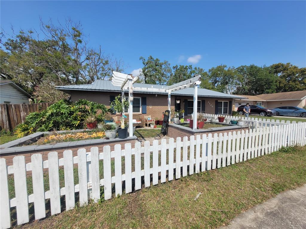 5203 Presidential Street Seffner, FL 33584 - Photo 2 of 21 a view of a house with a small yard