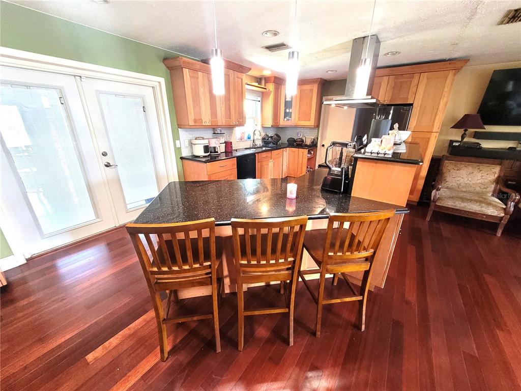 5203 Presidential Street Seffner, FL 33584 - Photo 8 of 21 a view of a dining room with furniture window and wooden floor