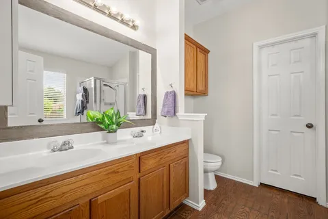 a bedroom with a bed and a chair