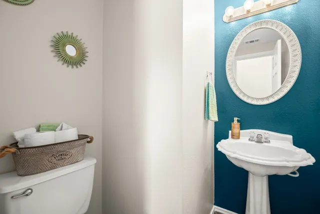 a kitchen with sink cabinets and dining table