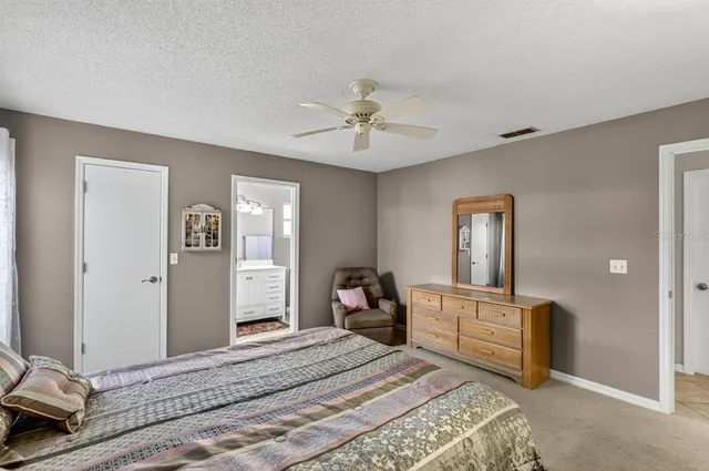 an aerial view of a house with a yard and garden