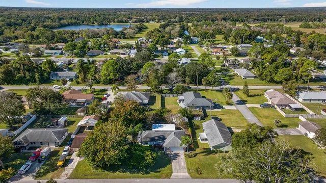 a front view of a house with a yard and porch