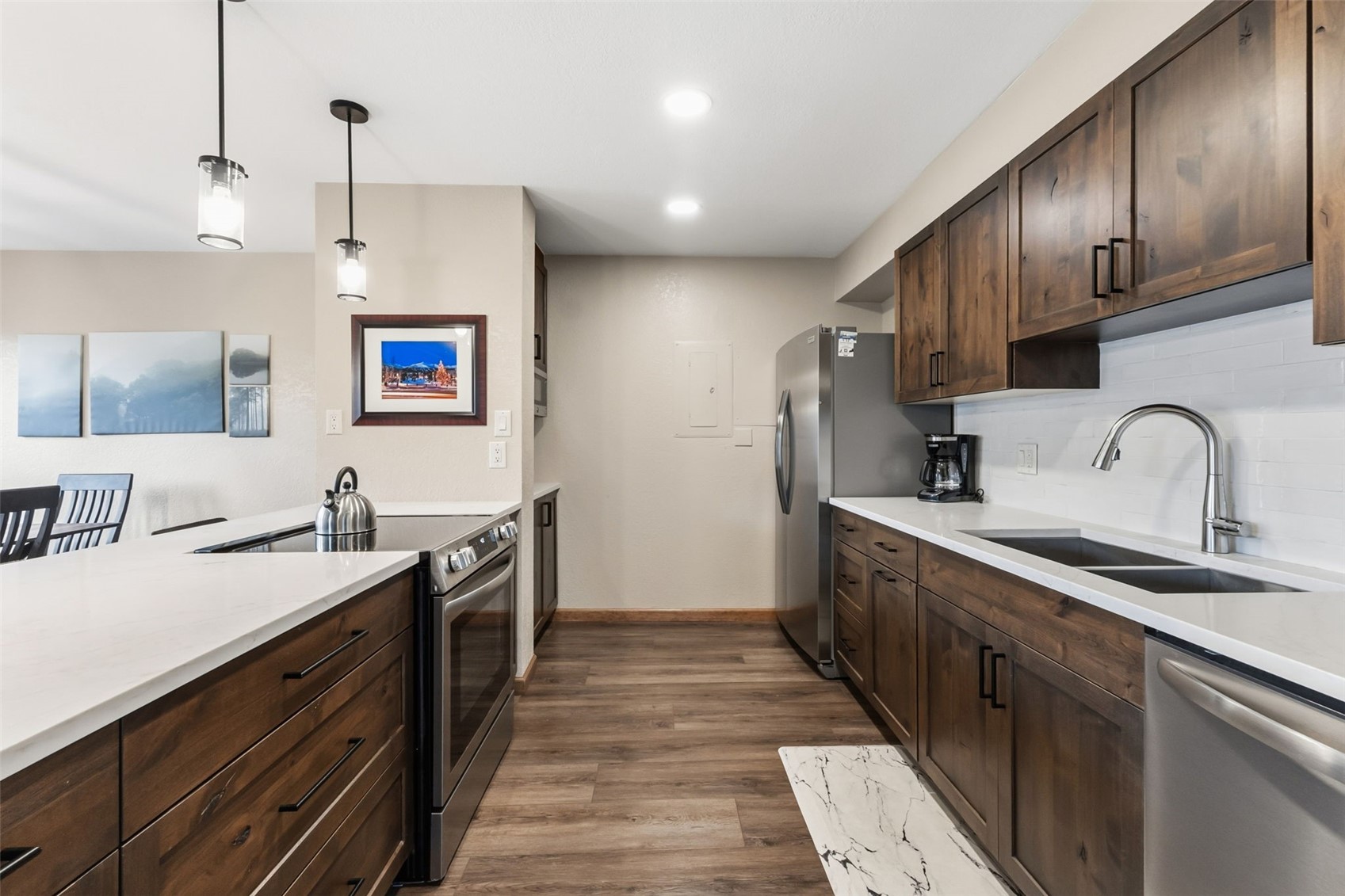 325 Four Oclock Road, Unit C301 Breckenridge, CO 80424 - Photo 11 of 26 a kitchen with stainless steel appliances granite countertop a sink stove and cabinets
