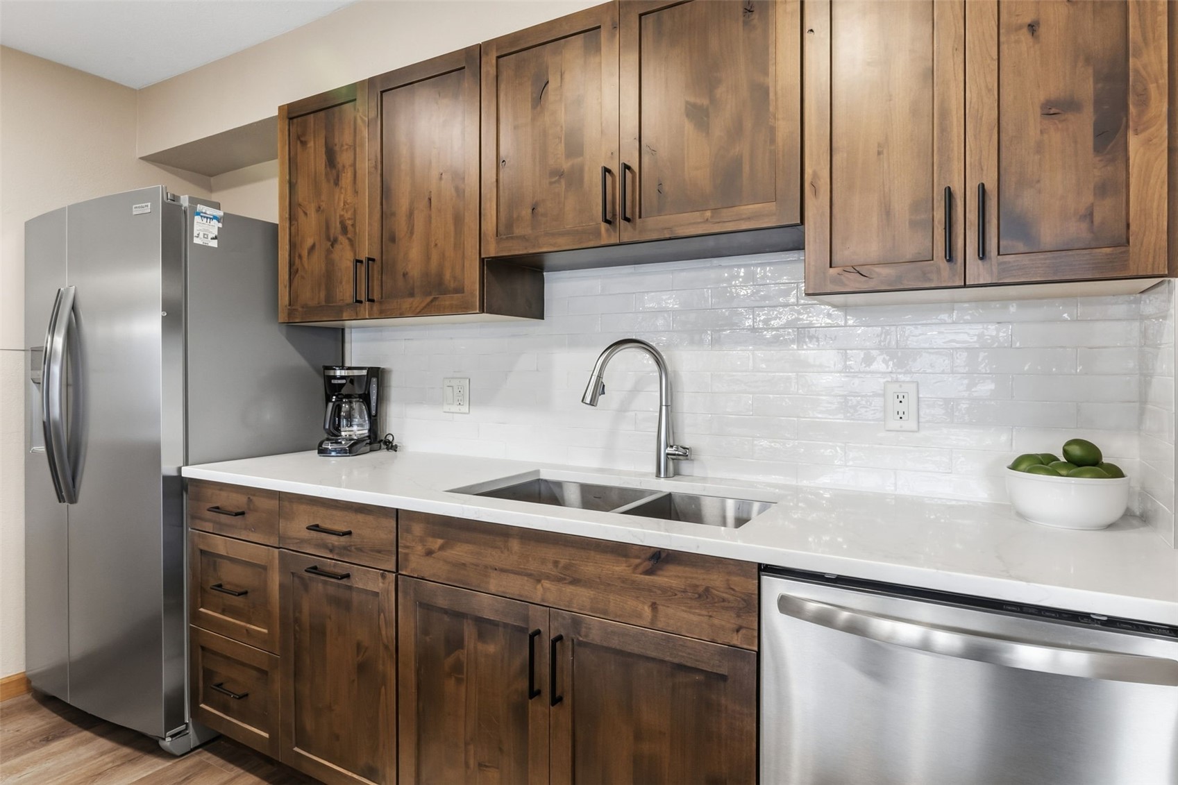 325 Four Oclock Road, Unit C301 Breckenridge, CO 80424 - Photo 12 of 26 a kitchen with stainless steel appliances granite countertop a sink a refrigerator and wooden cabinets
