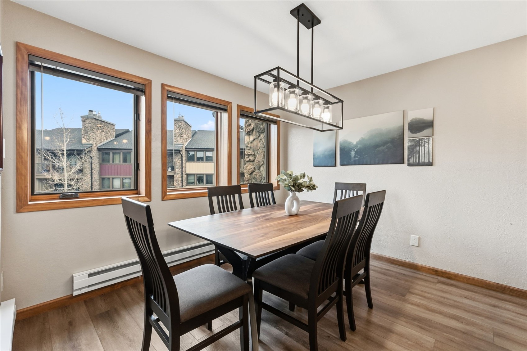 325 Four Oclock Road, Unit C301 Breckenridge, CO 80424 - Photo 7 of 26 a view of a dining room with furniture window and wooden floor