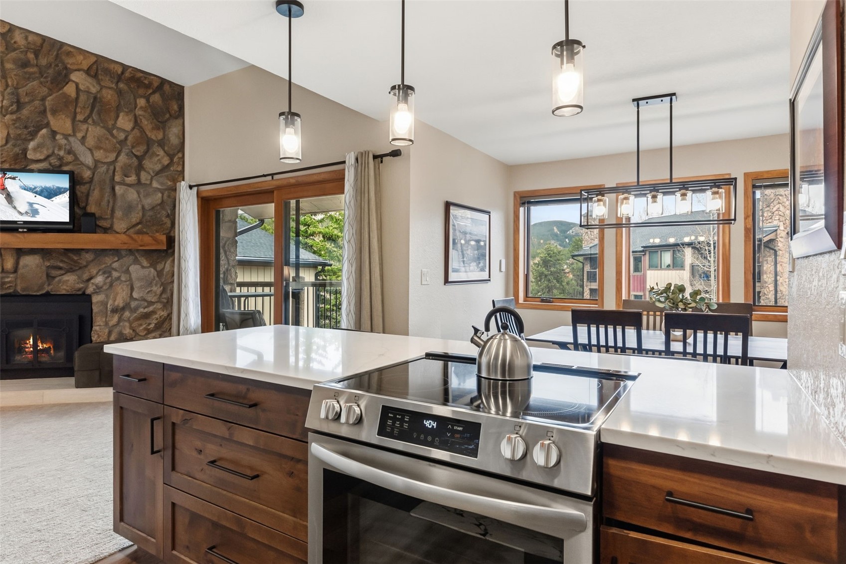 325 Four Oclock Road, Unit C301 Breckenridge, CO 80424 - Photo 10 of 26 a kitchen with a stove and a chandelier