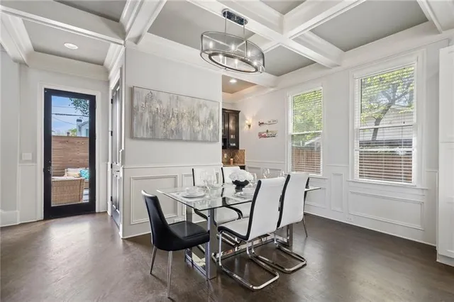 a view of a dining room with furniture and window