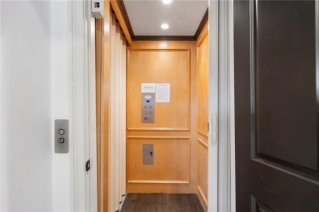 a bedroom with a bed and a fireplace