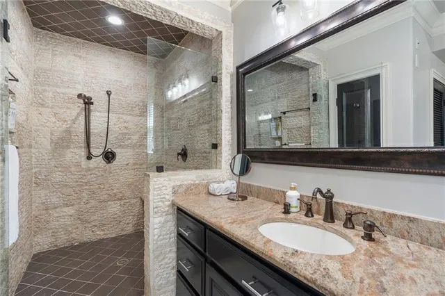 a bedroom with a large bed a flat tv screen and a window