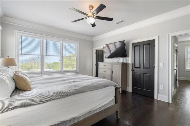 a bathroom with a toilet and a shower curtain
