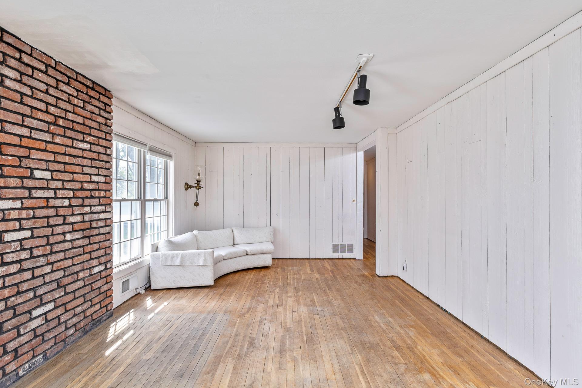 10 Fortune Court Commack, NY 11725 - Photo 15 of 34 White washed Knotty pine wall paneling.
