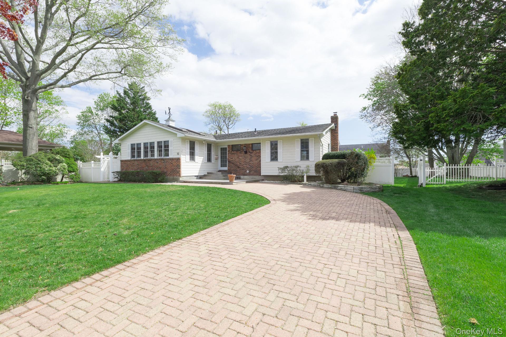 10 Fortune Court Commack, NY 11725 - Photo 2 of 34 Hardiplank Siding and Brick enhance the appeal of this ranch.