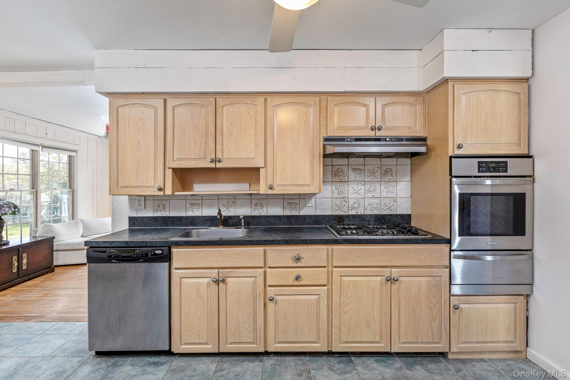 10 Fortune Court Commack, NY 11725 - Photo 8 of 34 Plenty of wood cabinetry and and stainless appliances.